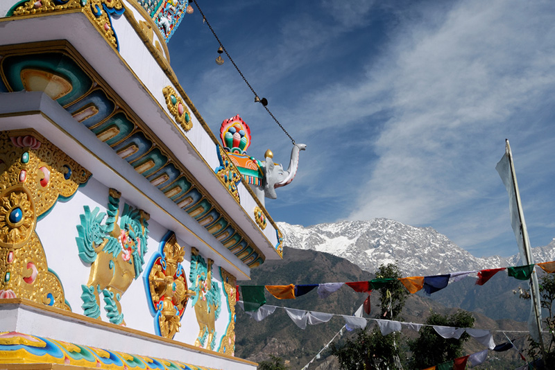 Kalachakra temple in McLeod Ganj, Dharamsala, with a view of the Himalayan mountains 